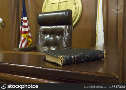 Bible beside judges chair in court