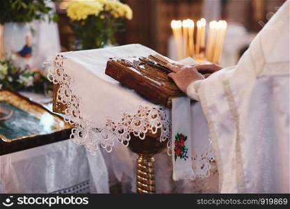 Bible on altar table. Faith and religion concept. Preaching background. Church interior. Lord's table concept. Holy holidays and Christmas concept. Christianity tradition.