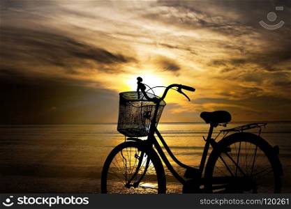 bicycle in sunset on the beach, silhouette image