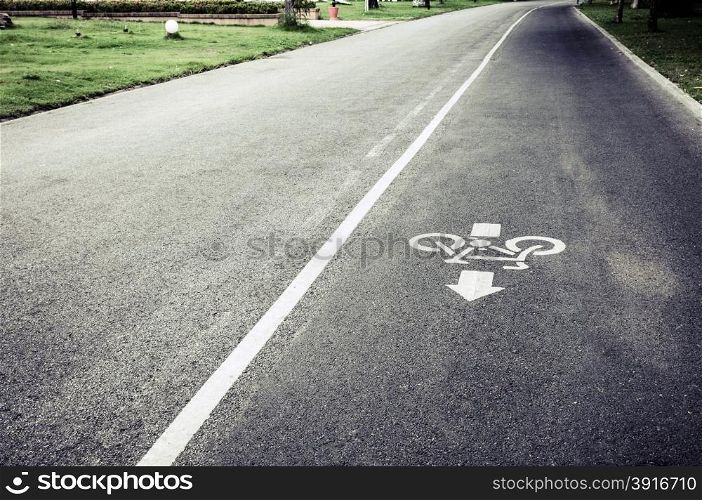 bicycle lane sign on the road