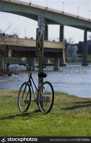 Bicycle leaning against a pole, Annapolis, Maryland, USA