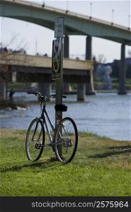 Bicycle leaning against a pole, Annapolis, Maryland, USA