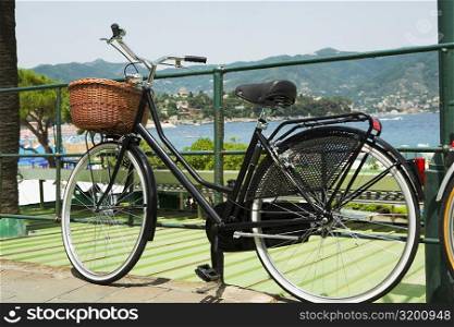 Bicycle leaning against a railing, Italian Riviera, Santa Margherita Ligure, Genoa, Liguria, Italy