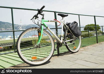 Bicycle leaning against a railing, Italian Riviera, Santa Margherita Ligure, Genoa, Liguria, Italy