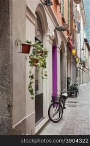 Bicycle on street of italian city. Como, Italy