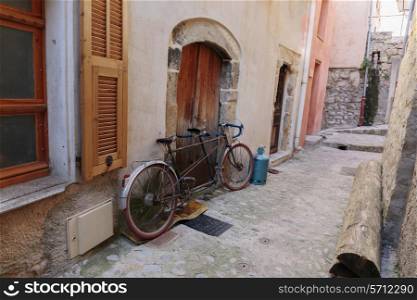 Bicycle on the old street in the village Coaraze, France