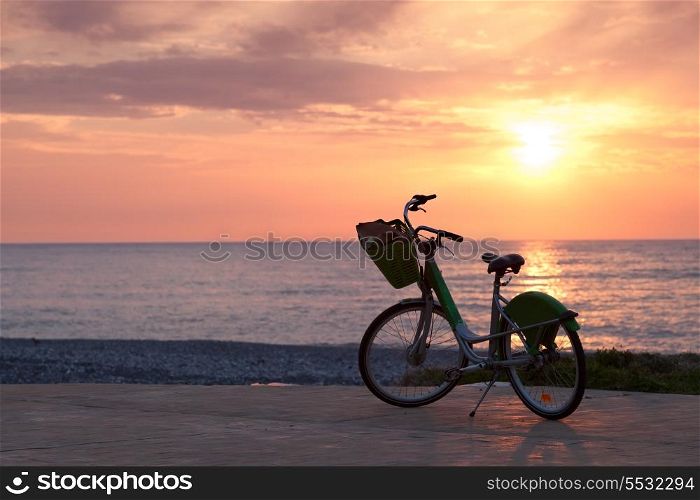 Bicycle on the pavement on Batumi beach, sunset