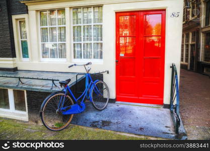 Bicycle parked near a house in Amsterdam, Netherlands