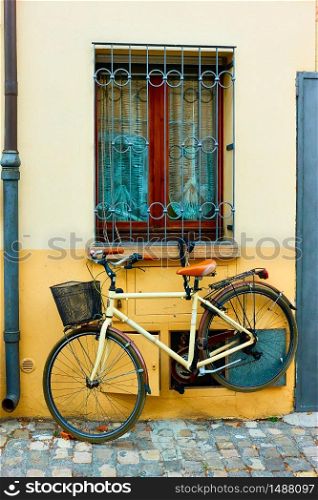 Bicycle parked near wall in Rimini, Italy