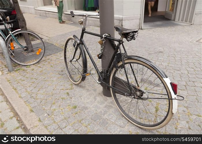 Bicycle parked on pavement in Brussel, Belgium&#xA;