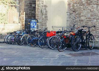 Bicycle parking on the background of the cityscape of Florence, Italy