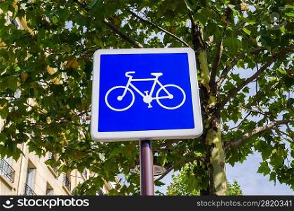 Bicycle sign on blue background