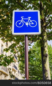 Bicycle sign on blue background