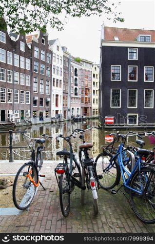 Bicycles near canal in Amsterdam. Focus on the foreground!