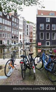 Bicycles near canal in Amsterdam. Focus on the foreground!