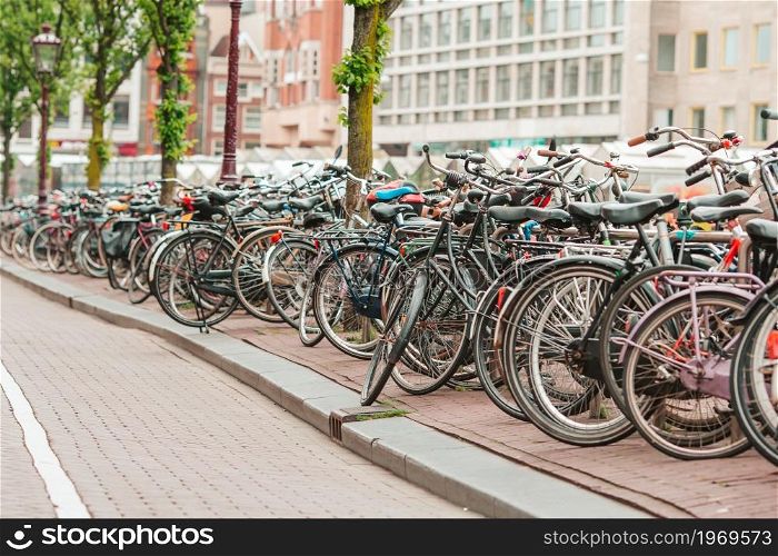Bicycles on the bridge in Amsterdam Netherlands. Bikes on the bridge in Amsterdam, Netherlands. Beautiful view of canals in autumn