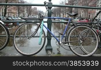 Bicycles parked along the canals in Amsterdam, Holland. Sequence