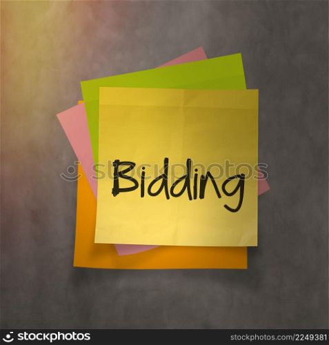 ""bidding" text on sticky note paper on wall texture"