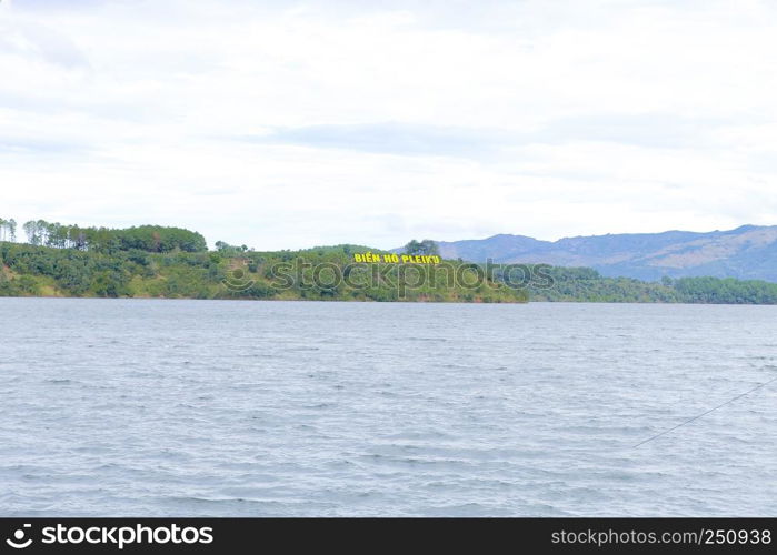 Bien Ho tourist area, ecotourism with big lake, pine forest around, green landscape, fresh air, people rowing boat on Bienho pond, Gia Lai, Vietnam