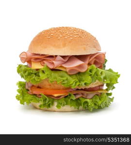 Big appetizing fast food sandwich with lettuce, tomato, smoked ham and cheese isolated on white background. Junk food hamburger.