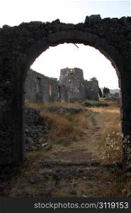 Big arc and ruins of fortress Besac near Virpazar, Montenegro