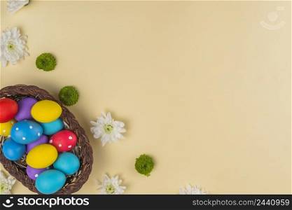 big basket with colorful easter eggs table