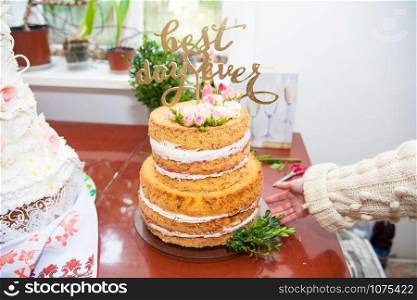 big beautiful wedding cake with fresh roses. big beautiful wedding cake and fresh roses