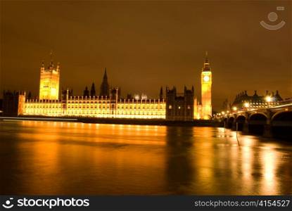 Big Ben and Parliament at night with reflections in river Thames