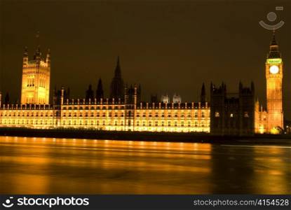 Big Ben and Parliament at night with reflections in river Thames