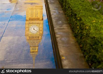 Big Ben Clock Tower puddle water reflection in London England