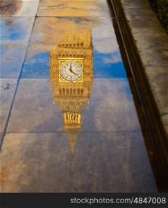 Big Ben Clock Tower puddle water reflection in London England