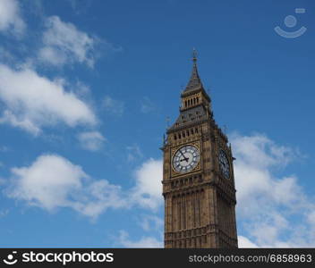 Big Ben in London. Big Ben at the Houses of Parliament aka Westminster Palace in London, UK - blue sky