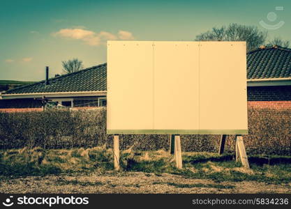 Big billboard sign in a neighborhood