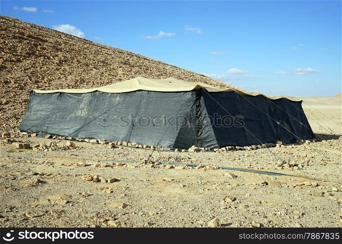 Big black tent and hill in Negev desert, Israel