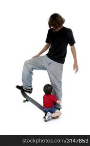 Big brother teaching little brother the art of skateboard.