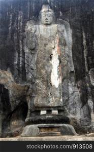 Big Buddha in rock temple Budurugala in Sri Lanka