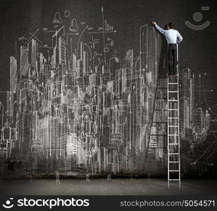 Big business plan. Rear view of businessman standing on ladder and drawing business sketch on wall