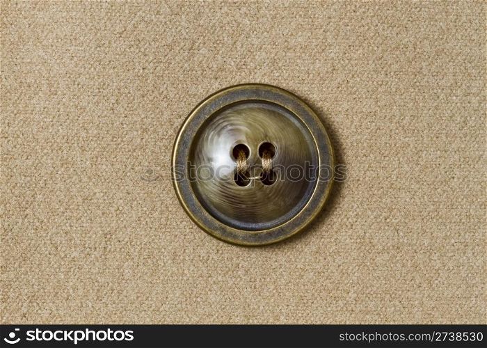 Big button fixed on fabric background