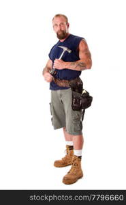 Big Caucasian guy with tattoos standing with hammer in his hands and wearing a tool belt, isolated.