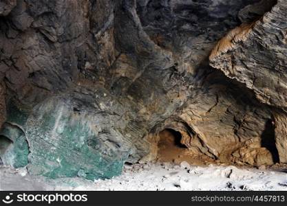 Big cave with green rock inside, Israel