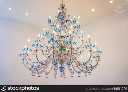 big chandelier and white lighting on the wall. Luxury Glass Chandelier