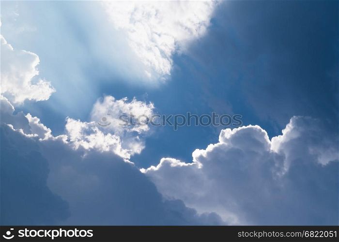 Big clouds and light beam