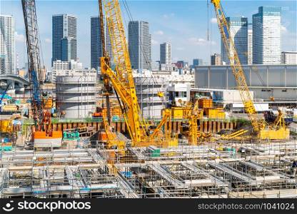 Big construction crane working in big construction site in Tokyo Japan