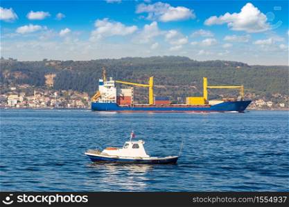 Big container ship in Dardanelles strait, Turkey in a beautiful summer day