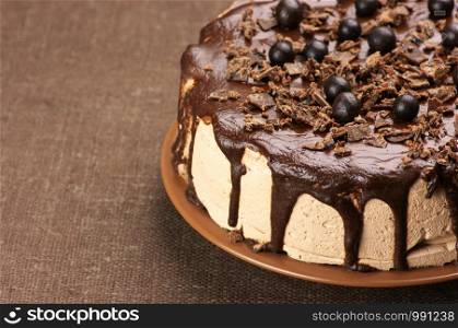 Big cream cake decorated with berries, chocolate chips, honey cream