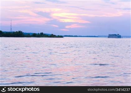 Big cruise boat on sunset river (Dnieper, Ukraine, Cherkasy Town).
