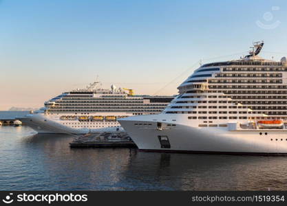 Big cruise ships docked at the port of Napoli, Italy in a beautiful summer day