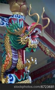 Big dragon on the column of chinese temple in park Dusit, Bangkok, Thailand