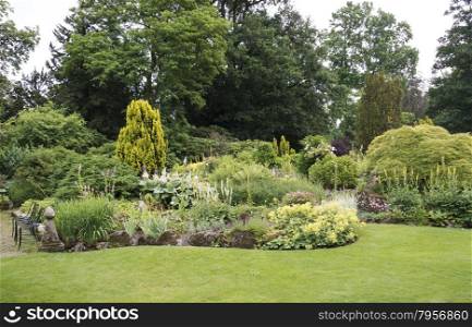 big english garden with borders and flowers