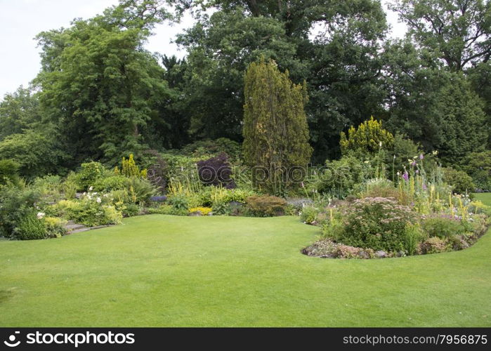 big english garden with borders and flowers